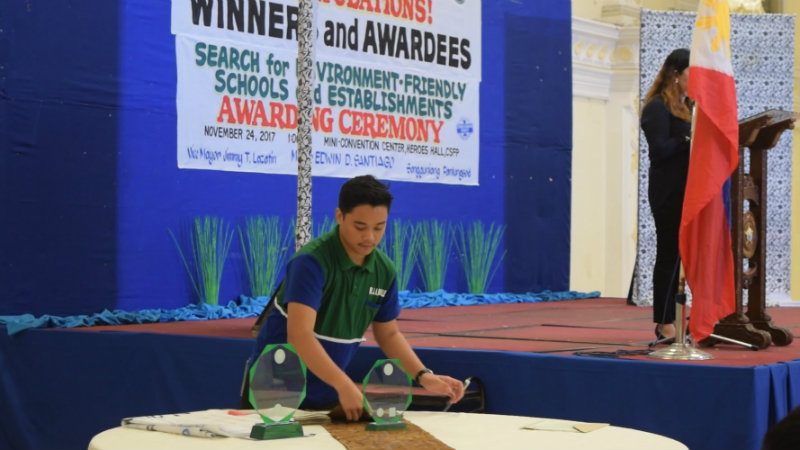 YOUTH LEADER. Jam Manalese, former president of the YES-O Network and current president of the Zero Waste Youth Pilipinas prepares trophies for the awarding of the cityâs most environmental schools. Photo by Khate Nolas 