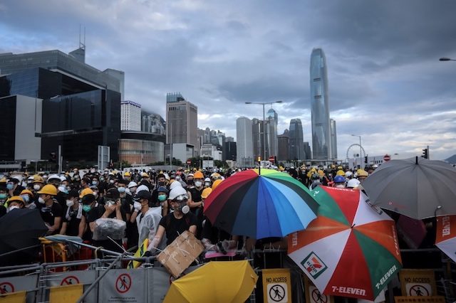 Protesters seize roads as Hong Kong braces for rally on handover anniversary