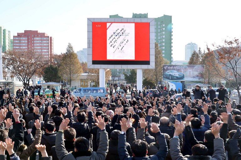 CELEBRATION. This photo taken on November 29, 2017 and released on November 30, 2017 by North Korea's official Korean Central News Agency (KCNA) shows people in Pyongyang celebrating the test of a Hwasong-15 intercontinental ballistic missile (ICBM). Photo by KCNA via KNS /AFP 