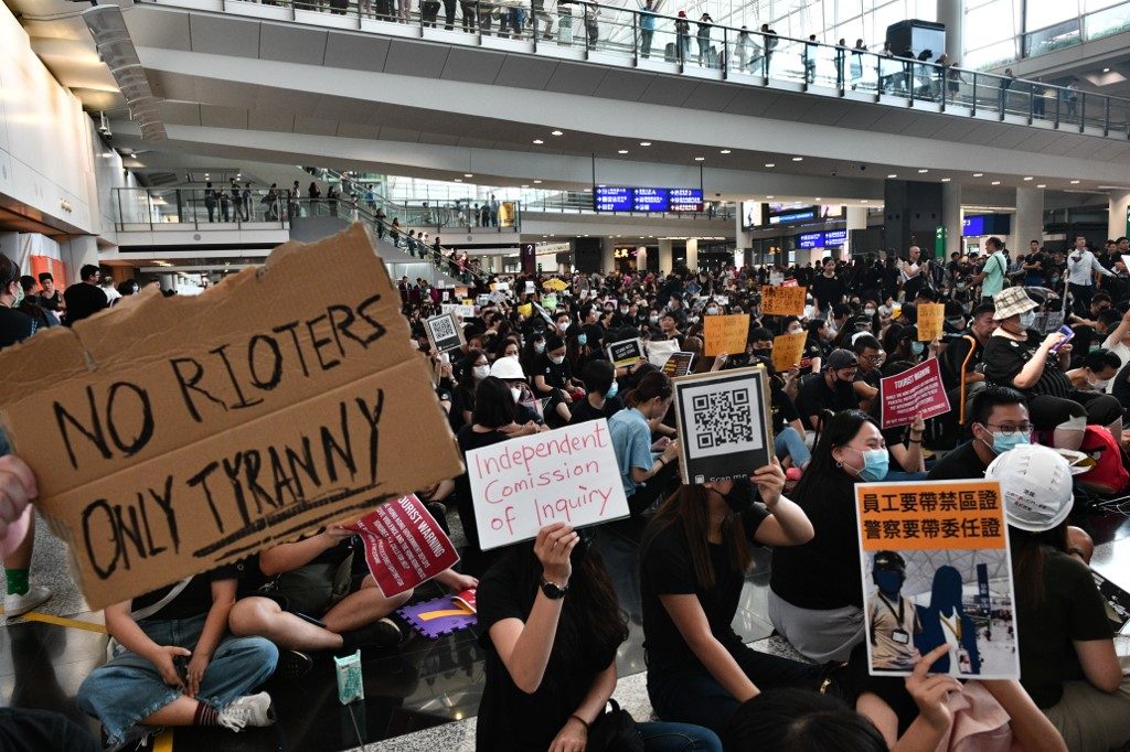 Hong Kong protesters rally at airport to ‘educate’ visitors