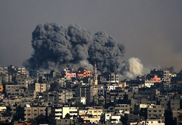 Smoke rises after an Israeli airstrike in Al Shejaeiya neighborhood during a military operation in eastern Gaza City, 22 July 2014. Mohammed Saber/EPA