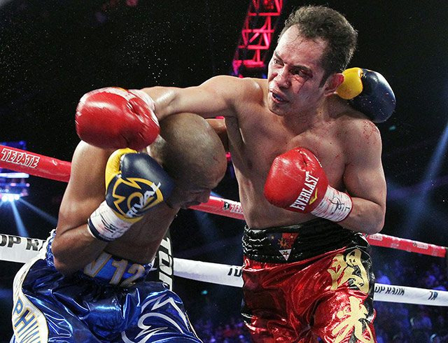 TECHNICAL DECISION. The fight went to the scorecards when Donaire could no longer continue due to a cut over his left eye. All three judges scored it 49-46. Photo by Chris Farina/Top Rank
