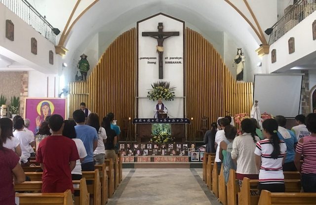 SUPPORT EACH OTHER. 'There is no other source of strength than the support we give each other, so let us not stop,' Fr Gilbert Billena tells the bereaved families. Photo by Eloisa Lopez/Rappler  