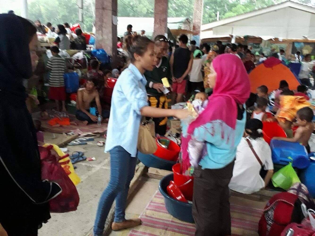 CROWDED. Najmah assists in the crowded evacuation center. Photo courtesy of Najmah Asum/YesPinoy 