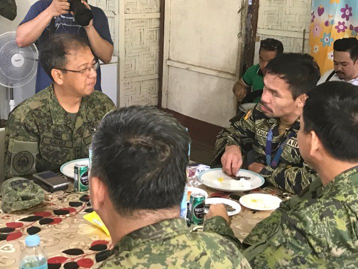 ONE OF THE TROOPS. Senator Manny Pacquaio shares a meal with members of the military on July 29. Photo courtesy of Westmincom. 
