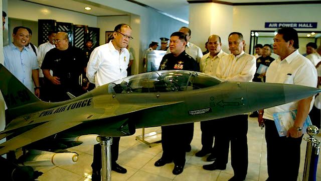 DECEMBER DELIVERY. President Benigno Aquino III checks out a model of the FA-50 fighter jet during the 68th anniversary celebration of the Philippine Air Force. Malacañang photo 