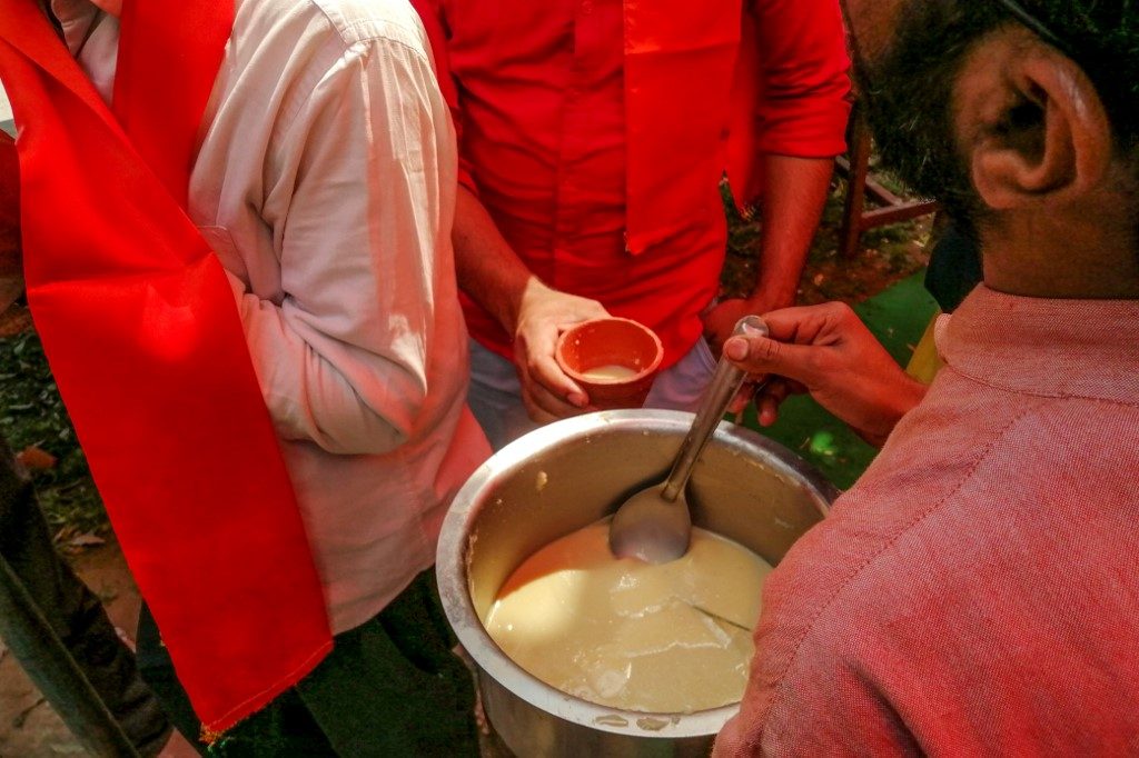 COW URINE. A man serves panchagavya, a traditional Hindu ritual mixture made of cow dung, urine, milk, curd and ghee, to members and supporters attending a 'gaumutra (cow urine) party' to fight against the spread of the COVID-19 coronavirus, organised by Hindu organisation 'Akhil Bharat Hindu Mahasabha' president Chakrapani Maharaj, in New Delhi on March 14, 2020. Photo by Jalees Andrabi/AFP 