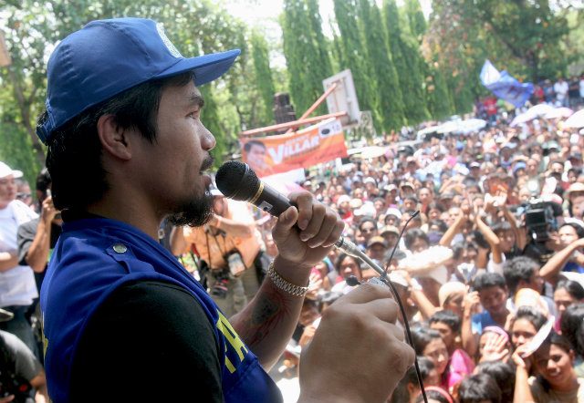 Manny Pacquiao speaks to supporters during the first day of his political campaign as congressman in his hometown in Sarangani, General Santos City. File phoyo by Val Handumon/EPA
