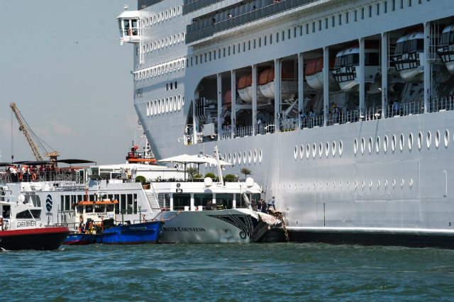 Cruise ship slams into Venice wharf as tourists flee