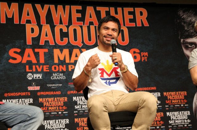 Manny Pacquiao answers questions from the media. Photo by Chris Farina - Top Rank 