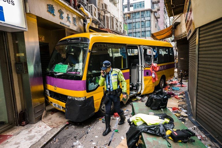 Three killed as empty Hong Kong school bus mounts pavement