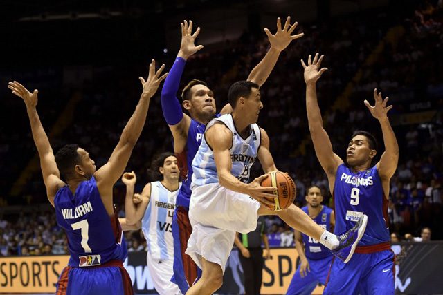 Argentina's guard Pablo Prigioni vies with  Gilas players Jayson William/Castro, June Mar Fajardo and Ranidel de Ocampo during the 2014 FIBA World basketball championships group B at the Palacio Municipal de Deportes in Seville, Spain on Sept.1. Photo by Pierre-Philippe-Marcou/AFP