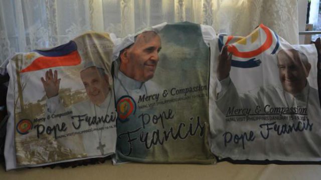 MERCY AND COMPASSION. Shirts for sale to commemorate the papal visit. 
