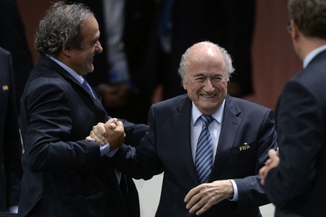 Defiant Blatter wins FIFA vote amid corruption storm