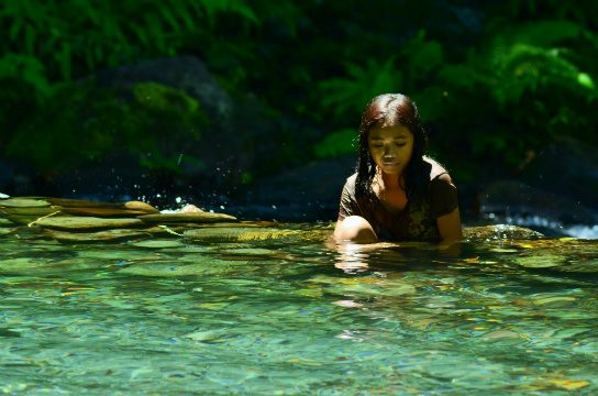 2ND PLACE. This image-capture of a woman seated in a body of water was a winning photo. Photo credits to Chanthaly Syfongxay (Lao PDR), Emmanuel Absalon (Philippines), Menchie Tulauan-Villarosa (Philippines), Mohammad Reiza (Indonesia), Muhammad Abduhoo Khalid (Pakistan). 