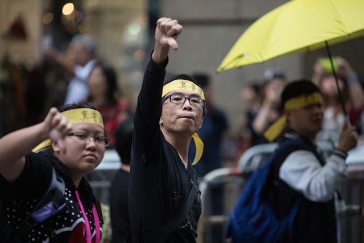 Hong Kong democracy protesters march to China office