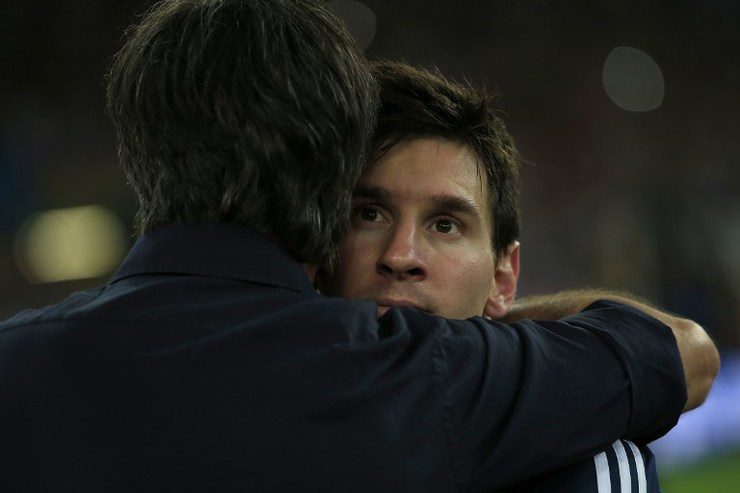 Germany's coach Joachim Löw consoles Lionel Messi after his team's glorious victory against Argentina in the 2014 World Cup final. Photo by Adrian Dennis/AFP