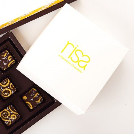 HELP CUSTOMERS. The role of chocolate makers like Pam Cinco of Risa Chocolates is to help customers taste excellent and real chocolate. Image from Risa Chocolates website 