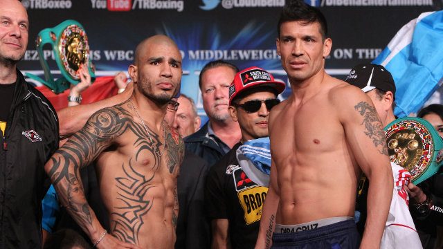 Miguel Cotto (L) and Sergio Martinez (R) pose at the weigh-in. Photo by Chris Farina - Top Rank