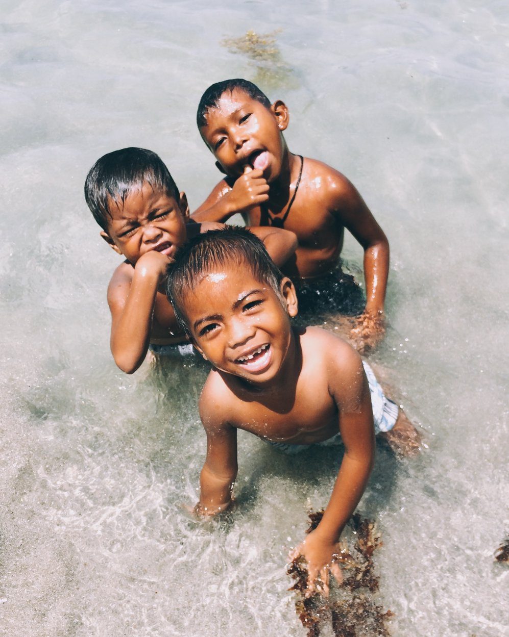 SWIM AND PLAY. After helping their parents, these kids always find time to have fun under the sun.  