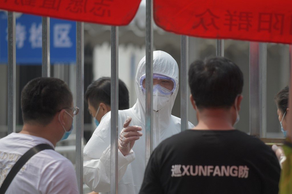 Half a million in lockdown as Beijing fights new virus cluster
