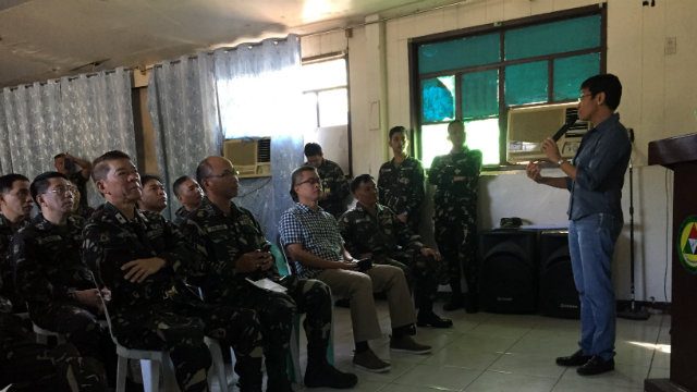 TOP DOWN. Maria Ressa talks to officers and troops of the NCR Regional Community Defense Group, Army Reserve Command at Fort Bonifacio. 