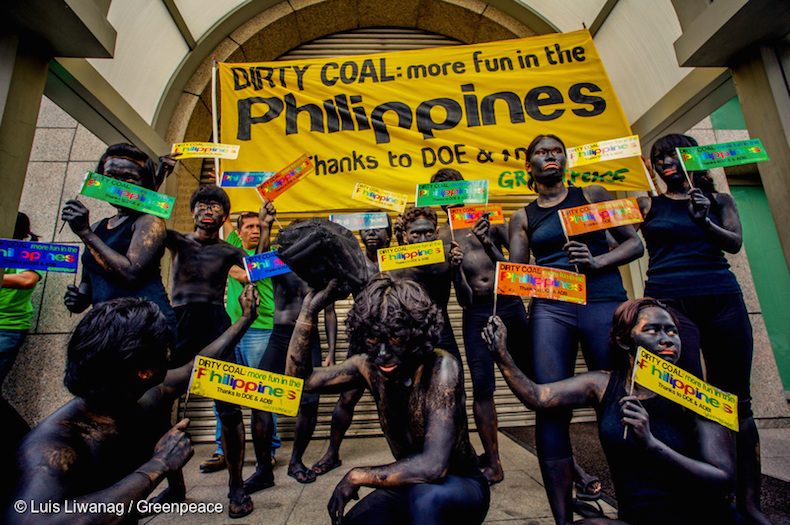 BURNING TRUTH. Environmental advocates paint themselves black to protest against the use of fossil fuels as a source of energy. Photo from Greenpeace  