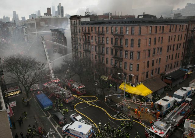 19 hurt as blast, then fire bring down New York buildings
