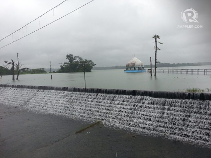 Water spills over the 80.15 meter boundary of La Mesa Dam on Friday (September 19, 2014). Manila Water declared a red level alert or a force evaquation on early thursday to the residents residing near rivers that is connected to the Dam. Photo by Jansen Romero/Rappler