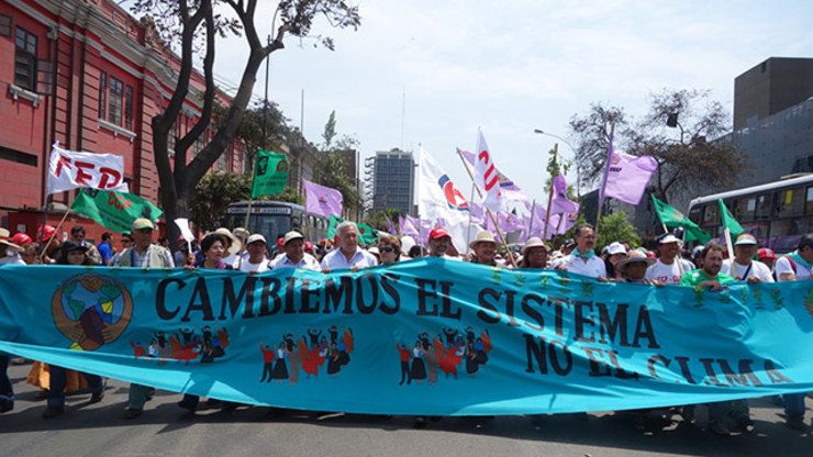 SYSTEM CHANGE. Marchers in Lima, Peru