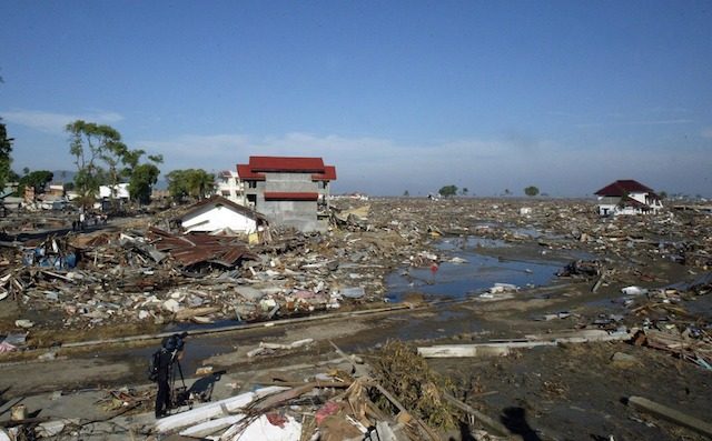 THE DESTRUCTION. A cameraman documenting the damage caused by the 2004 Indian Ocean tsunami in Banda Aceh. File photo by EPA