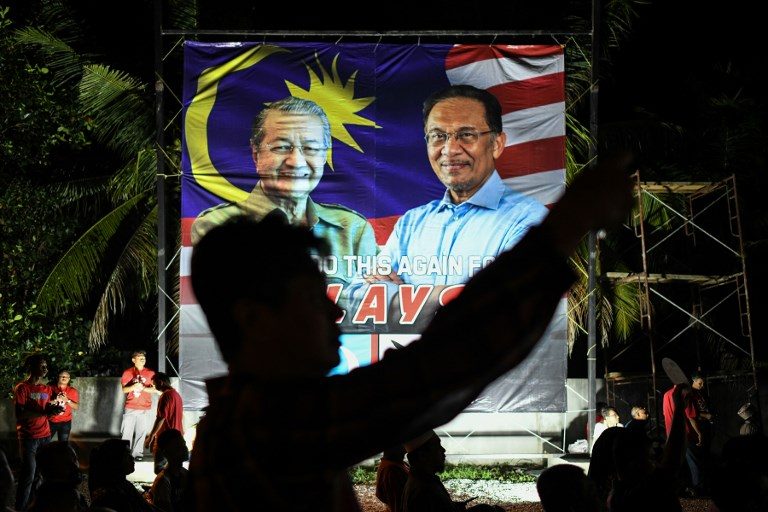 Malaysia’s Anwar Ibrahim urges voters to oust scandal-hit government