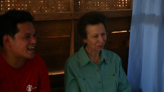 KINDESS. Princess Anne smiles as she listens to one of the beneficiaries of Save the Children in a Yolanda-affected town in Leyte. Beside her is a translator.   