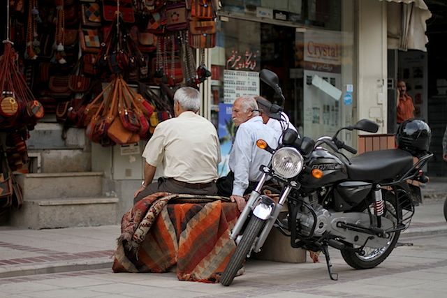 WAITING. Shopkeepers outside the Vakil Bazaar in Shiraz. 