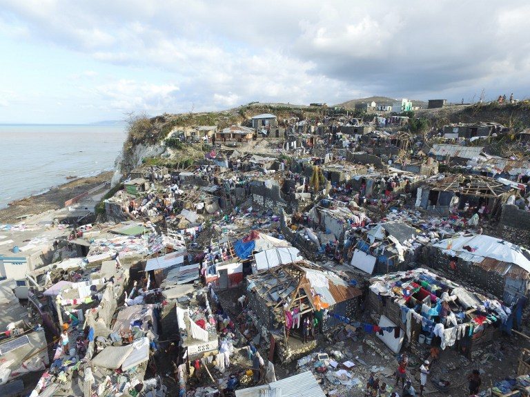 Haiti in pain as hurricane toll soars, aid sought