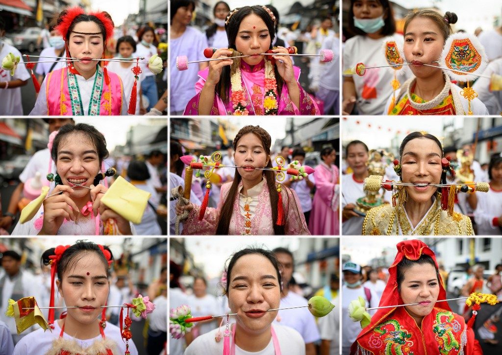 PIERCED. This combination containing 9 photos shows devotees of a Chinese shrine with skewers pierced through their cheeks taking part in a procession during the annual Vegetarian Festival in Phuket on October 5, 2019. Photo by Mladen Antonov/AFP 
