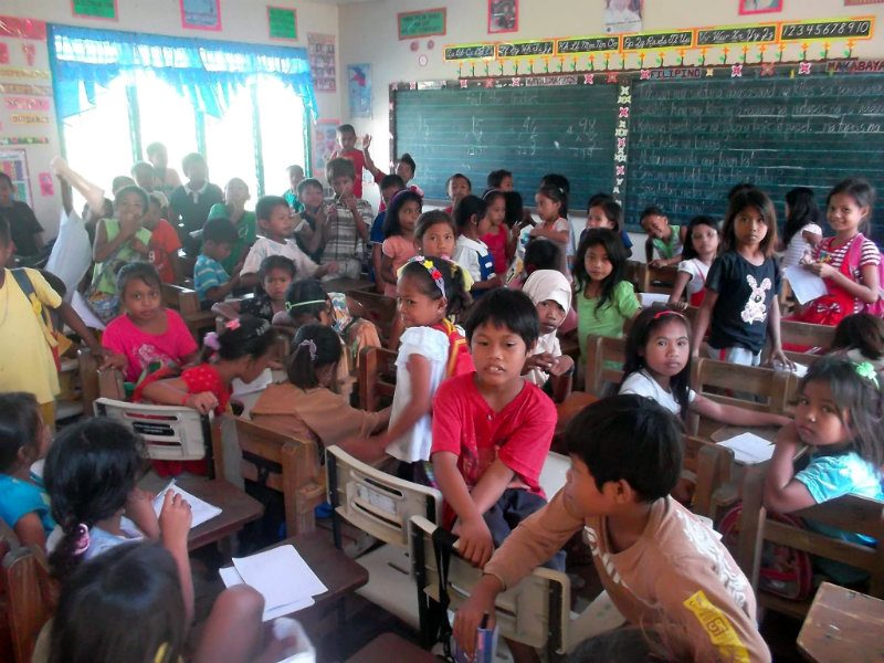 ROOM FOR IMPROVEMENT. More than 100 students are in this classroom were two sections of Malingao Elementary School, from grades 1-4, are combined. 