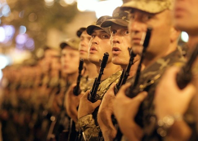 Ukrainian soldiers sing the national anthem at the Independence Square in downtown Kiev, Ukraine, 20 August 2014 during a rehearsal of the military parade which will be held in honour of Independence Day of Ukraine on 24 August. Tatyana Zenkovich/EPA