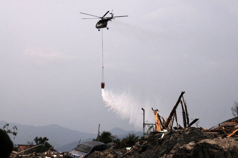 Indonesia drops disinfectant on quake-hit Palu