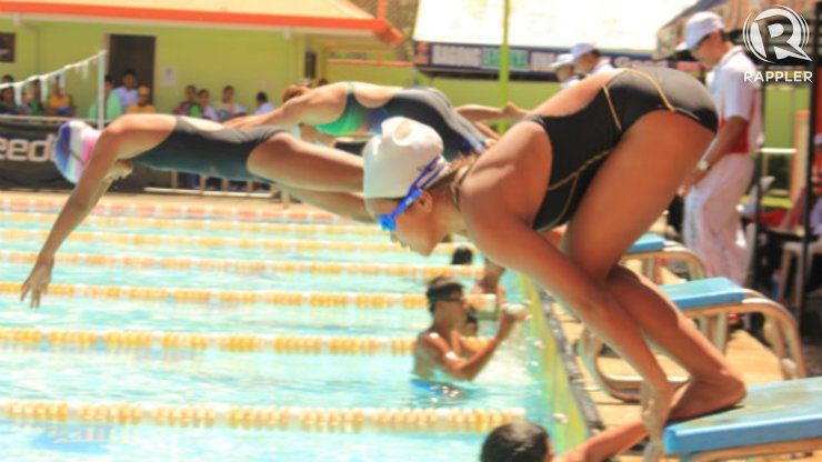 A girl sets to dive into the pool at Palaro 2014. Photo by Maan Tengco/Rappler