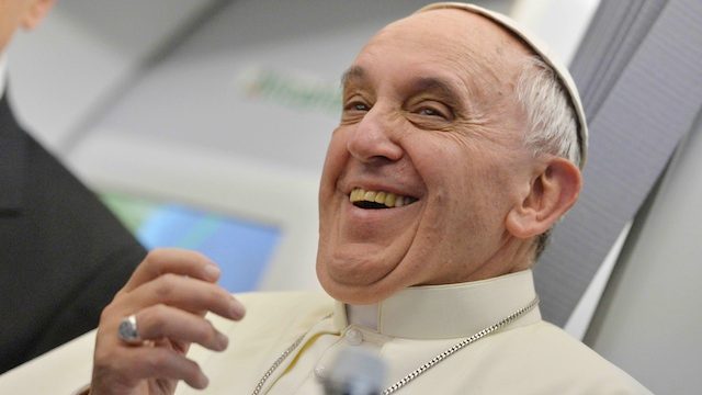 Tired but smiling, the pope gets back to work