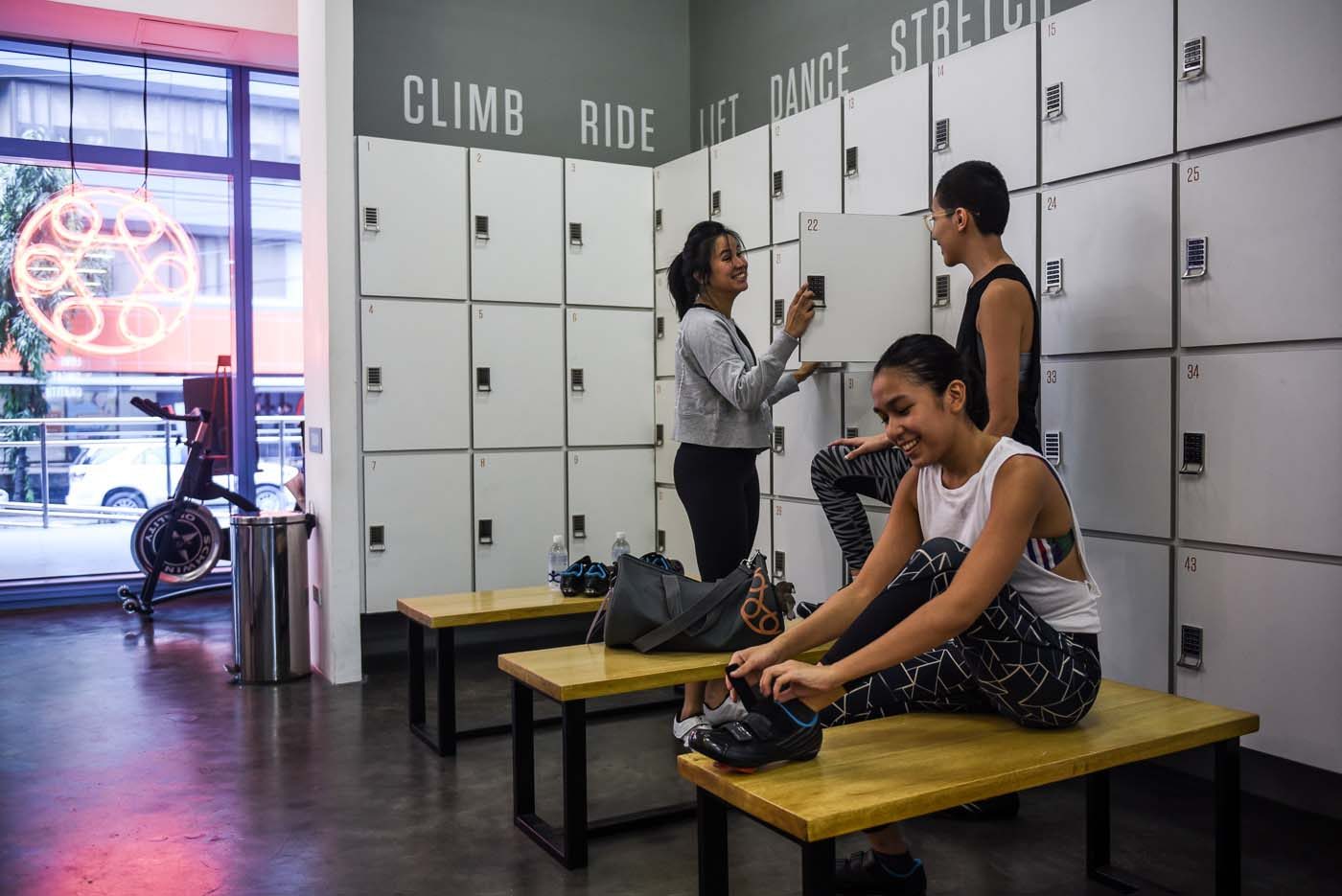 (L to R) Instructor Pia with crew members Sherlaine and Marga by the studio's lockers.  