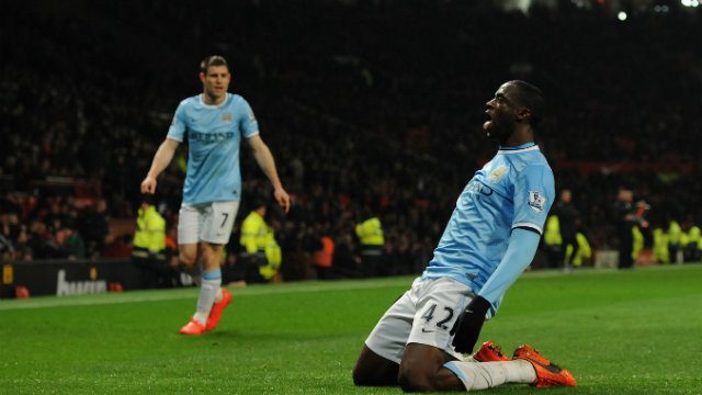 Manchester City's Yaya Toure celebrates scoring the third goal during the English Premier League soccer match between Manchester United and Manchester City in March. Photo by Peter Powell/EPA