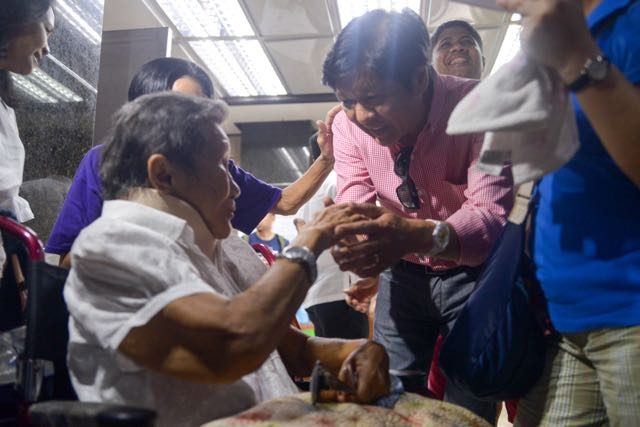 LOYALIST. Vice presidential candidate Senator Ferdinand "Bongbong" R. Marcos Jr. pays respect to 76-year old Marcos loyalist Nenita Leonor at the Adventist Medical Center in Pasay City today. Photo from the Office of Senator Bongbong Marcos  