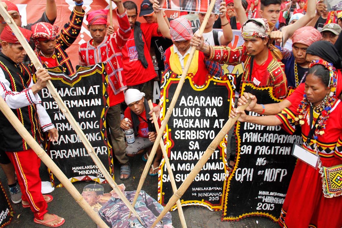 END MILITARIZATION. Members of the Lumad protest militarization in Mindanao in front of AFP and PNP headquarters. Photo by Joel Liporada/Rappler  