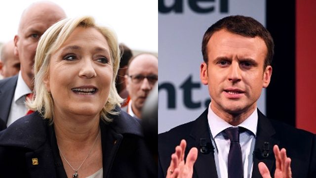 Frontrunners Le Pen, Macron hold rival Paris rallies