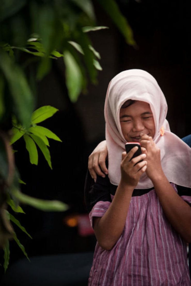 CHEERFUL GIRL. Raudhatul Jannah, 14, smiles after being reunited with her family in Meulaboh, Aceh. File photo by EPA