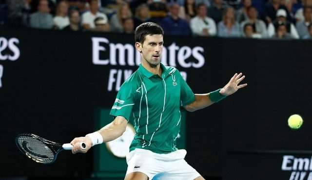 Djokovic keeps focus to set up Federer semifinal in Australian Open