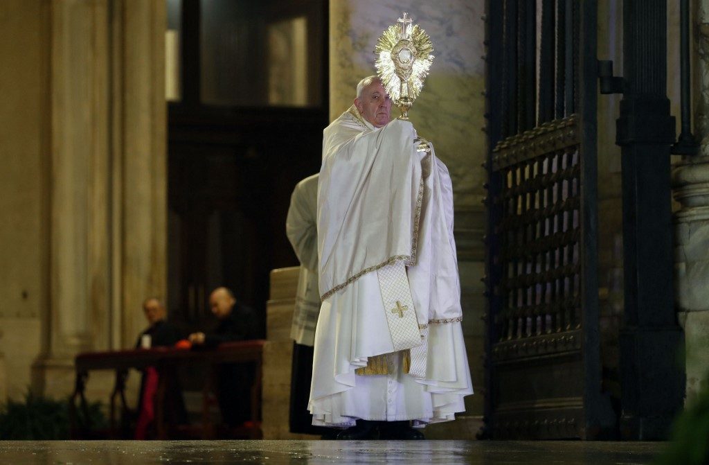 URBI ET ORBI. Pope Francis gives the Urbi et Orbi blessing after presiding over a moment of prayer on the sagrato of St Peter's Basilica, the platform at the top of the steps immediately in front of the facade of the Church, on March 27, 2020 at the Vatican. Photo by Yara Nardi/Pool/AFP 