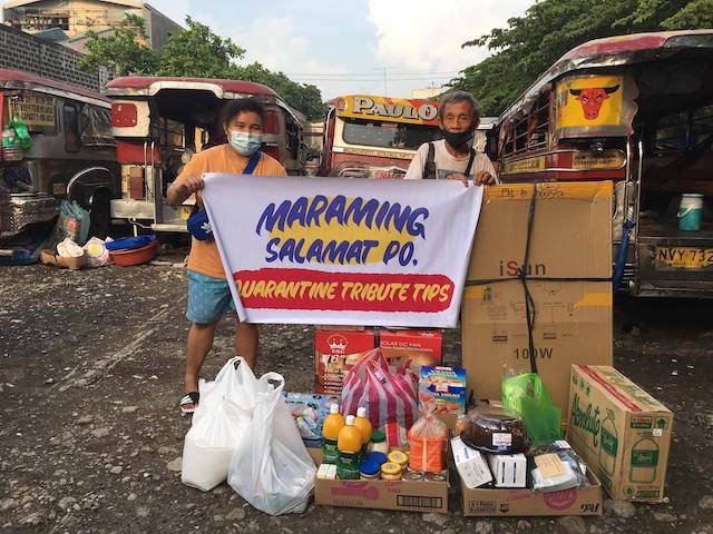 IN GRATITUDE. Tatay Alberto and Ayla hold a banner thanking the group for the distribution of relief to 100 jeepney drivers. Photo courtesy of Ayla Conda 